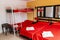 Red romantic hotel room hostel with yellow walls in Mallorca