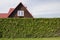 The red roof of standard rural private wooden small house and h