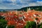 Red roofs in the city Prague. Panoramic view of Prague from the Prague Castle, Czech Republic. Summer day with blue sky with cloud