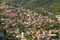 Red roofs of houses and buildings, village near Kotor in Montenegro, aerial view