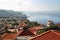 Red roofs of Madeira houses near the ocean