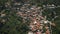 Red roofs mountain village houses aerial panorama. Cottages in highland slope mount village