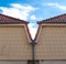 Red Rooftop Gutter With Downspout