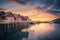 Red rorbu on wooden piles on sea coast, small jetty, colorful sky