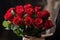 red rose bouquet being presented to special person, with romantic and sweet gesture
