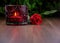 Red rose with candle on a wooden background stock images