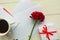 red rose, coffee cup and gift box on wooden table