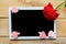 Red rose and decorative hearts on the mockup tablet. Valentine`s Day, Wedding or Mother`s Day greeting card.