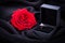 Red rose and diamond ring in a box