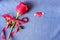 Red rose and flying mini heart on blue jean background. Love delivery and Valentine's concept