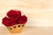 Red rose in gold basket, Valentines Day, wedding day, wood background.