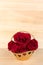 Red rose in gold basket, Valentines Day, wedding day, wood background.