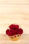 Red rose in gold basket, Valentines Day, wedding day, wood background.