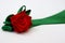Red rose with green petals made from a satin ribbon