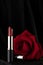 Red Rose and Lipstick on Black Background