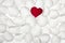 Red rose petal heart shape over white