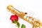 Red rose, saxophone and notes