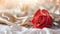 Red rose on the silk bedsheet. Happy Valentine\\\'s Day greeting card concept.