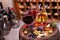 Red, rose and white glasses and bottles of wine. Grape, fig, nuts and leaves on old wooden barrel.