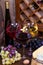 Red, rose and white glasses and bottles of wine. Grape, nuts, cheese and old wooden barrel.