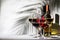 Red, rose and white wine glasses set on gray table background. Wine tasting. Hard light and harsh shadows