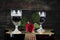 Red Rose and Wine Glasses Resting On Acoustic Guitar With Sign R