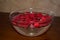Red Rosepetals In Water filled Bowl
