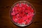 Red Rosepetals In Water filled Bowl