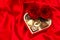 Red roses and assorted chocolate pralines in gift box