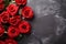 Red roses bouquet on dark stone background