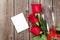 Red roses, champagne and greeting card