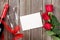 Red roses, champagne and greeting card