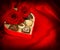 Red roses and chocolate pralines heart gift box