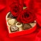 Red roses and delicious chocolate pralines