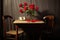 red roses on a dining table with two empty chairs