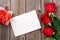 Red roses, greeting card and gift box