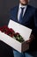 Red roses in an original box to his beloved woman