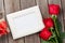 Red roses, photo frame and gift box