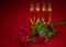 Red roses, two glasses of champagne and a box in the form of a red heart on a red background in honor of Valentine`s day