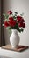 Red roses vase on white table light background