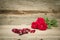 Red roses on wooden background.