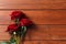 Red roses on a wooden background. Love confession. Valentine`s day