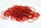 Red rubber band on the white background.
