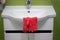 Red rubber gloves on a white washbasin in the bathroom.