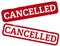 Red rubber stamp with word CANCELLED