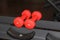 Red rubberized dumbbells for muscle work and weighting in the gym