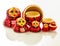 Red russian nesting dolls isolated on a white background.