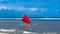 Red sail on a colorful traditional Balinese boat