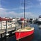 Red sailboat moored at the Petosky City Marina in Michigan.