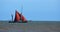 Red Sailed Barge sailing just off Suffolk coast.